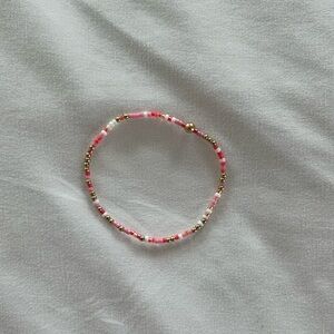 Selling this pink and gold e newton bracelet. It is the smaller size!